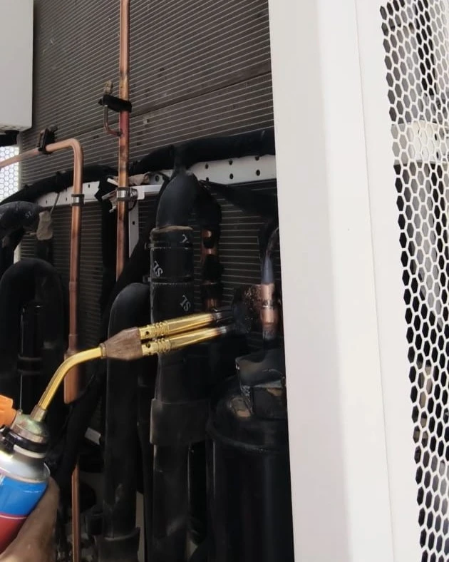 Brazing copper pipelines for industrial BESS chiller compressor repair